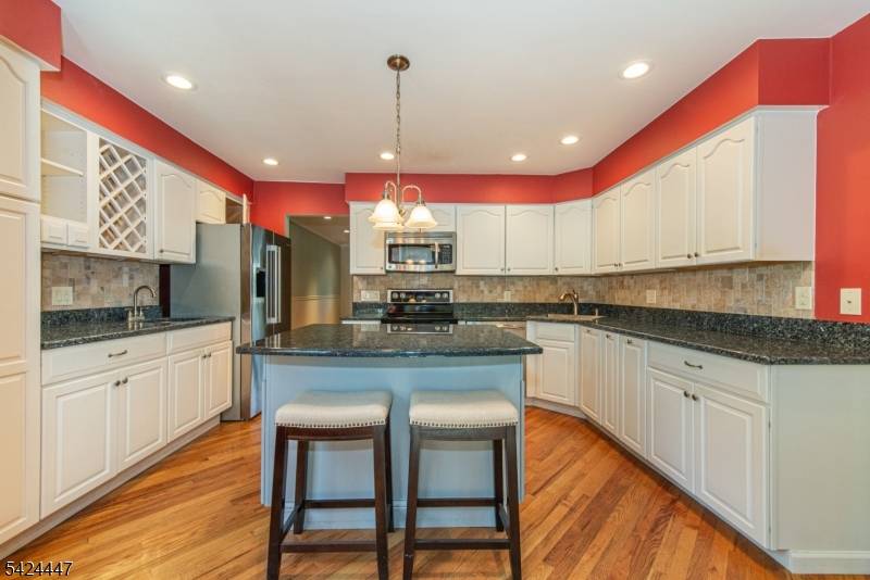 This 4 bedroom expanded ranch is much larger than it appears !