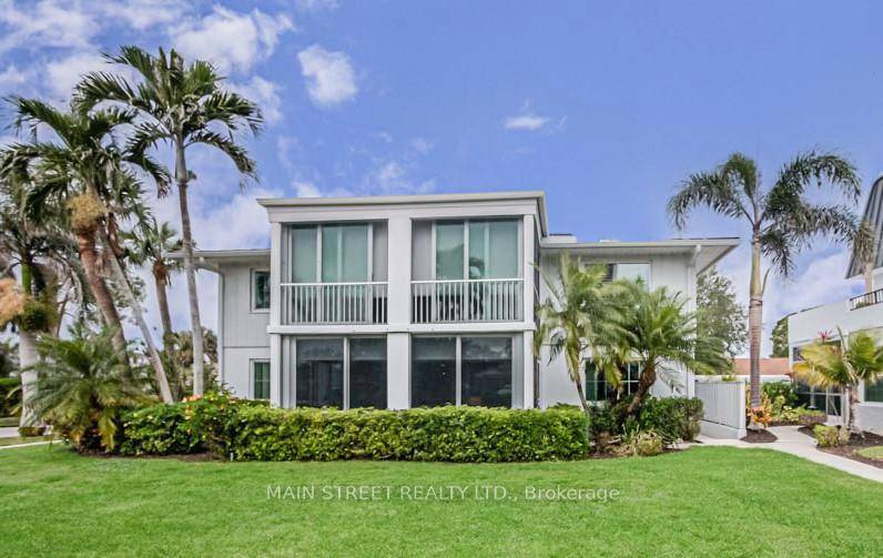 This partially furnished, light and bright 1st floor unit in Harborside Terrace in Park Shore provides panoramic landscaped views from your private climate controlled lanai with impact sliding doors.