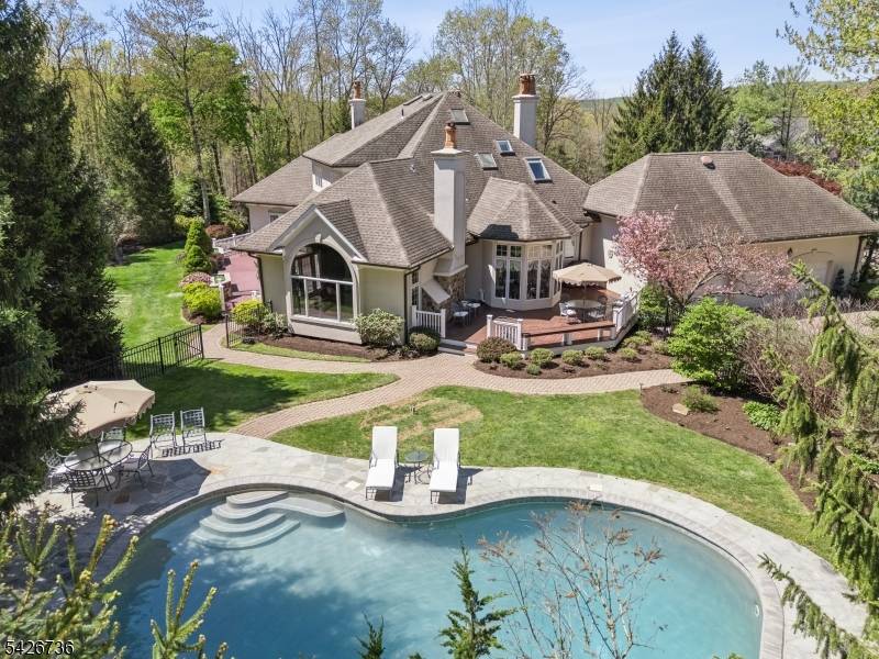 Custom architecture meets an unforgettable backyard in this stunning ranch style retreat, ideally positioned at the end of a quiet cul de sac in Watchung's most prestigious neighborhood.