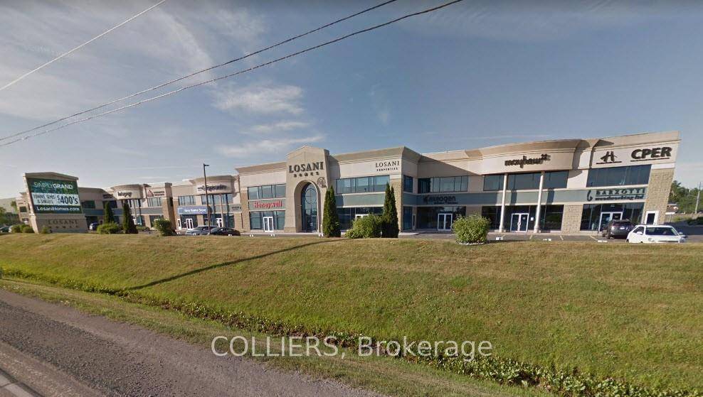 Fully furnished first floor office space with QEW exposure.