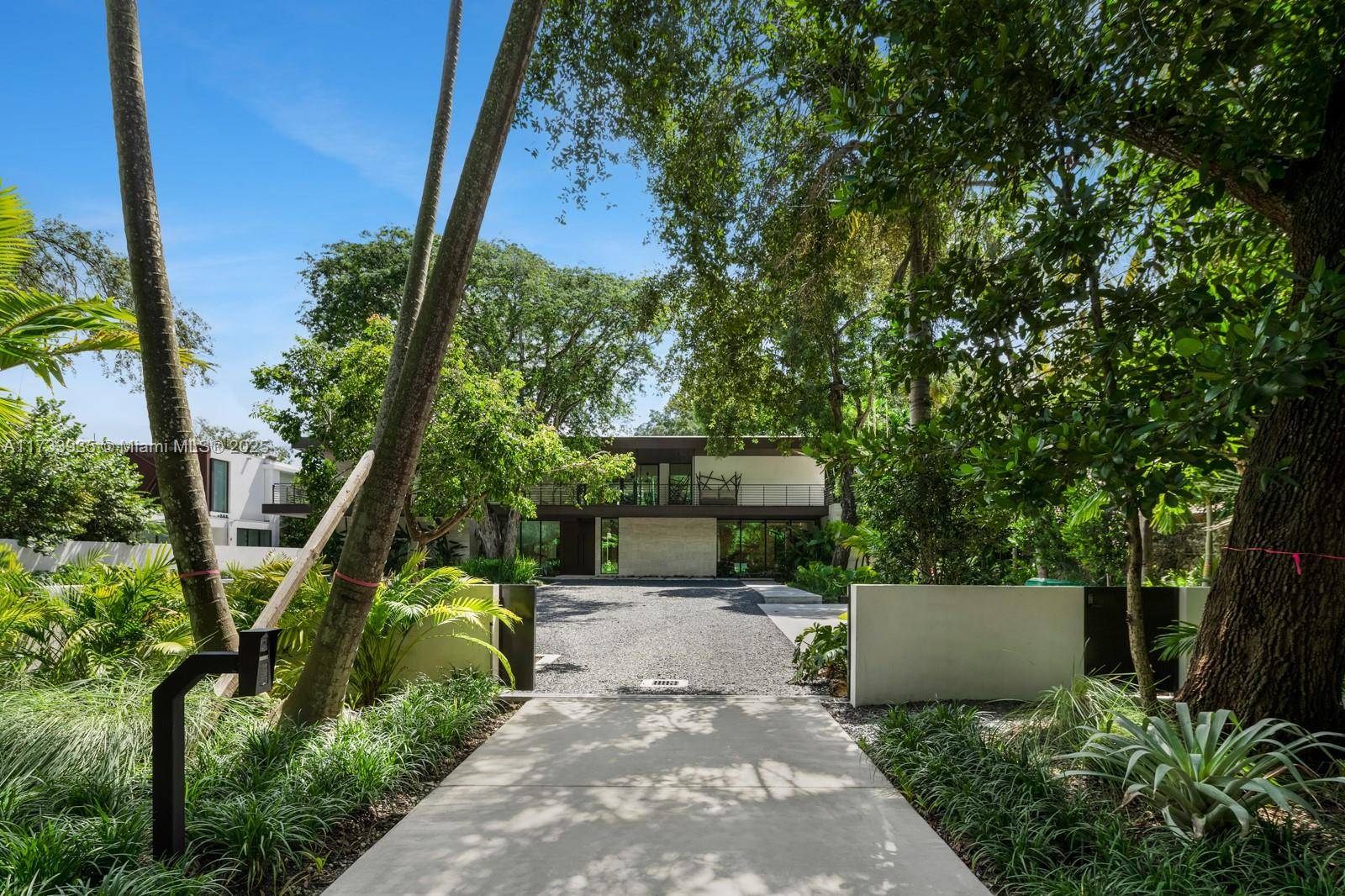 Elevate your expectations in this stunning contemporary masterpiece in the heart of Coconut Grove.