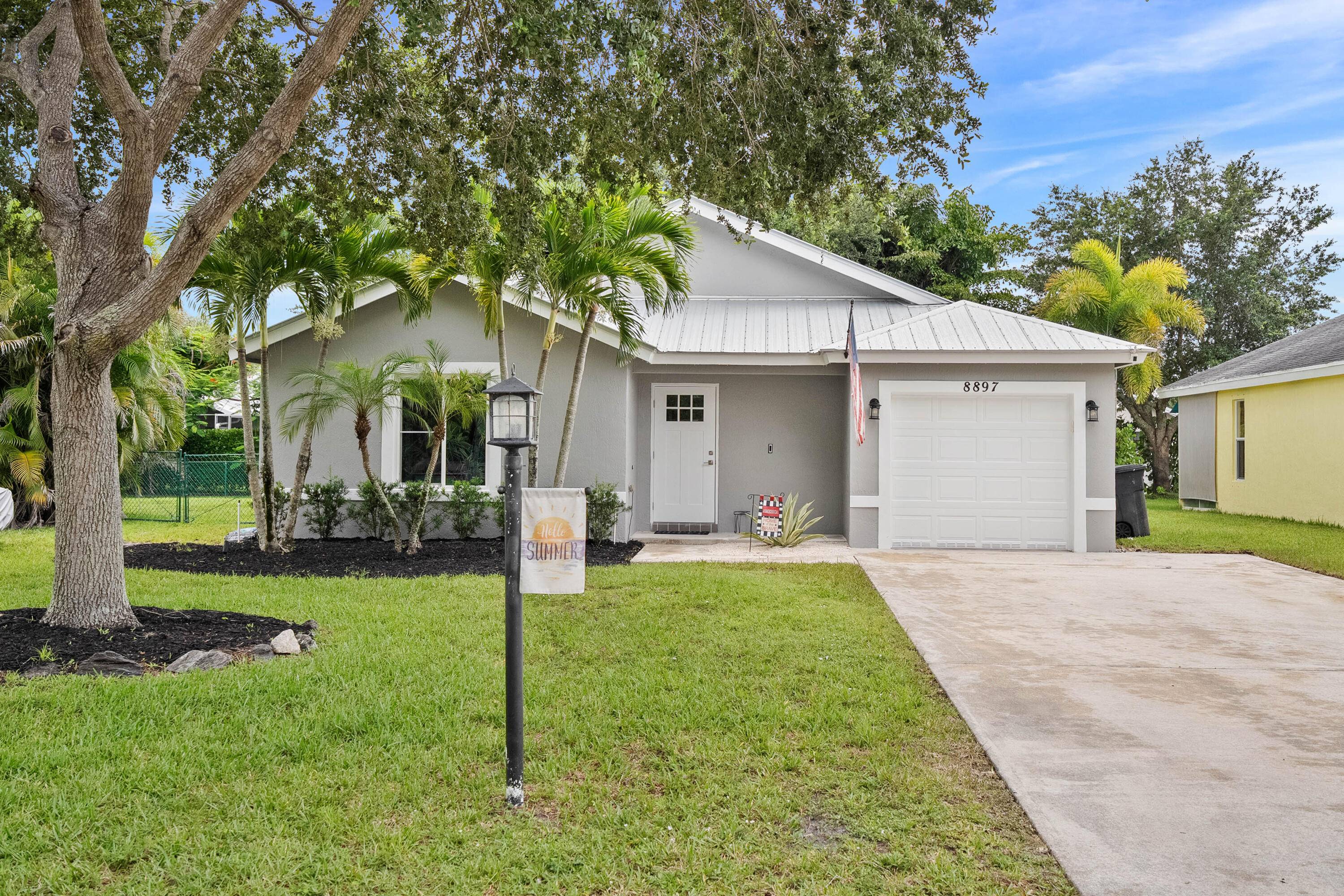 Solid concrete home with new Metal Roof, Impact windows and doors, located in the family friendly neighborhood of River Forest !