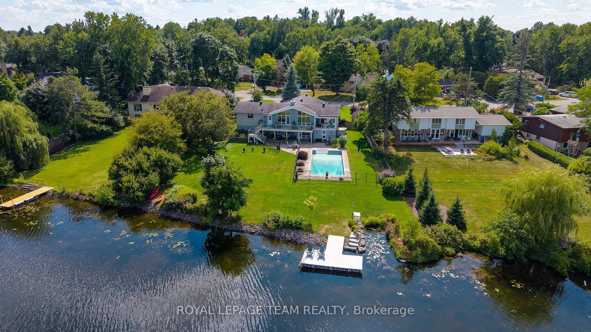 Incredible waterfront bungalow with walk out lower level on Manotick's popular North Island.