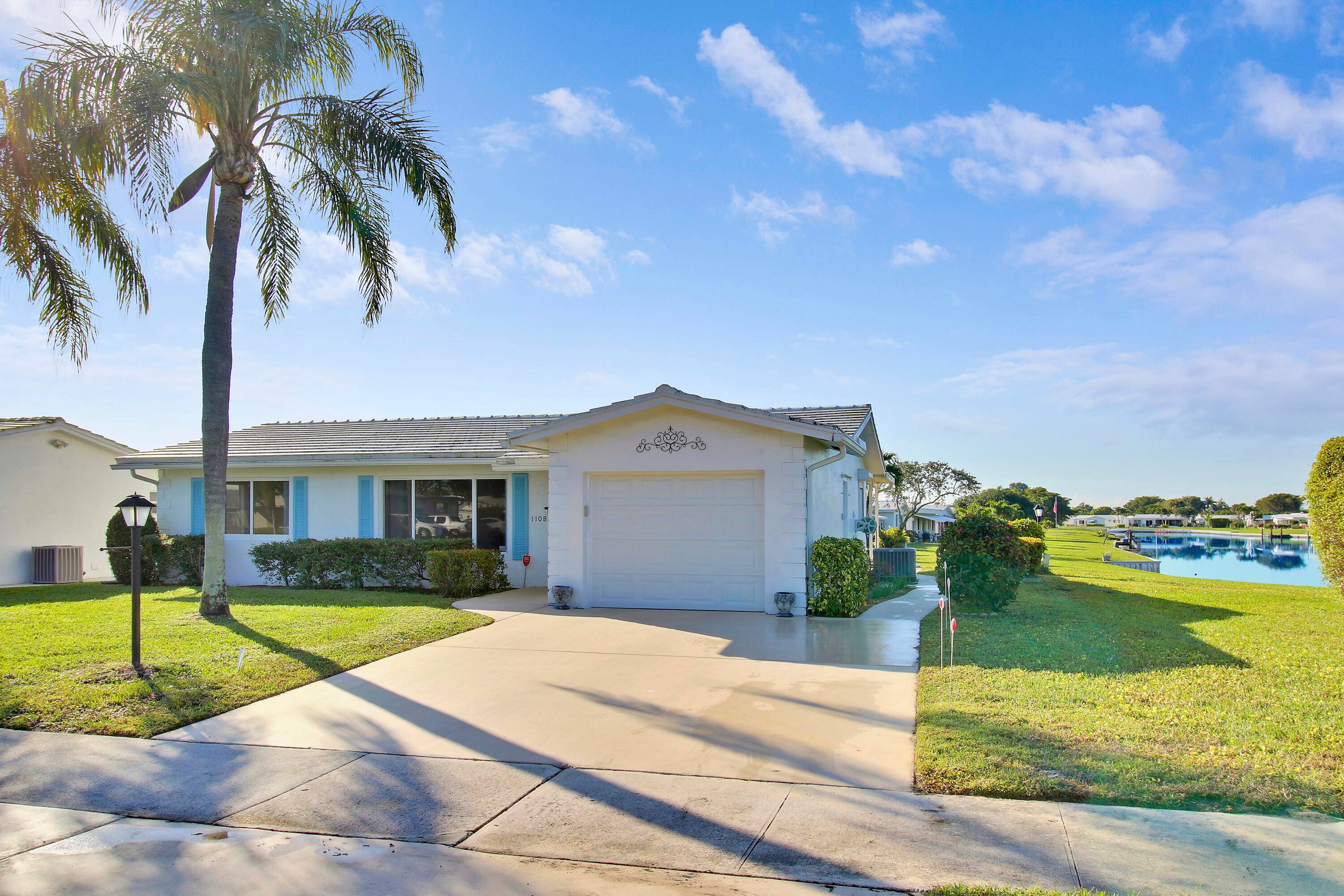 Welcome to this Leisureville gem on a prime corner lot with stunning canal views !