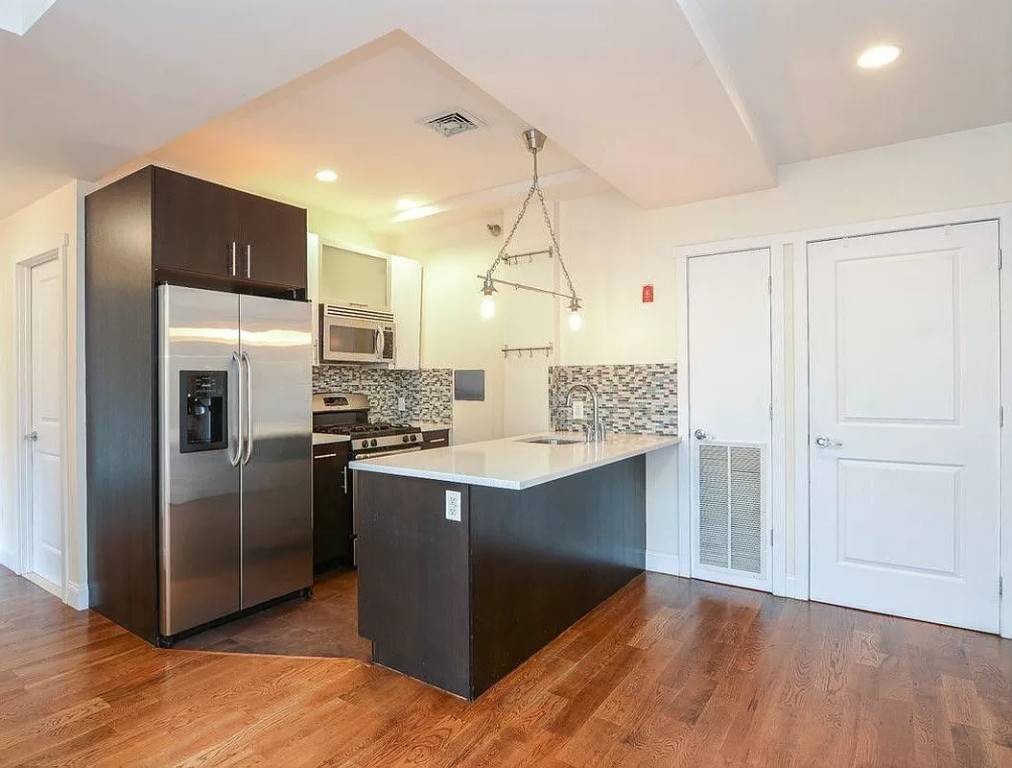 Spacious 910 sqft two bedroom, two bathroom apartment with private balcony, in unit washer dryer, high ceilings, lots of sunlight, plenty of closet space, and hardwood floors throughout.