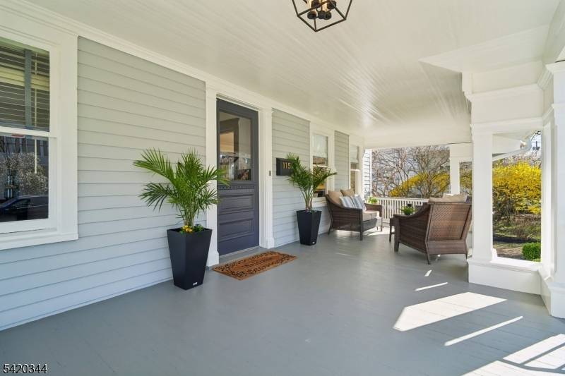 Urban sophistication meets suburban ease in this meticulously renovated 1897 colonial with Victorian charm, where timeless architectural detail blends modern comfort.