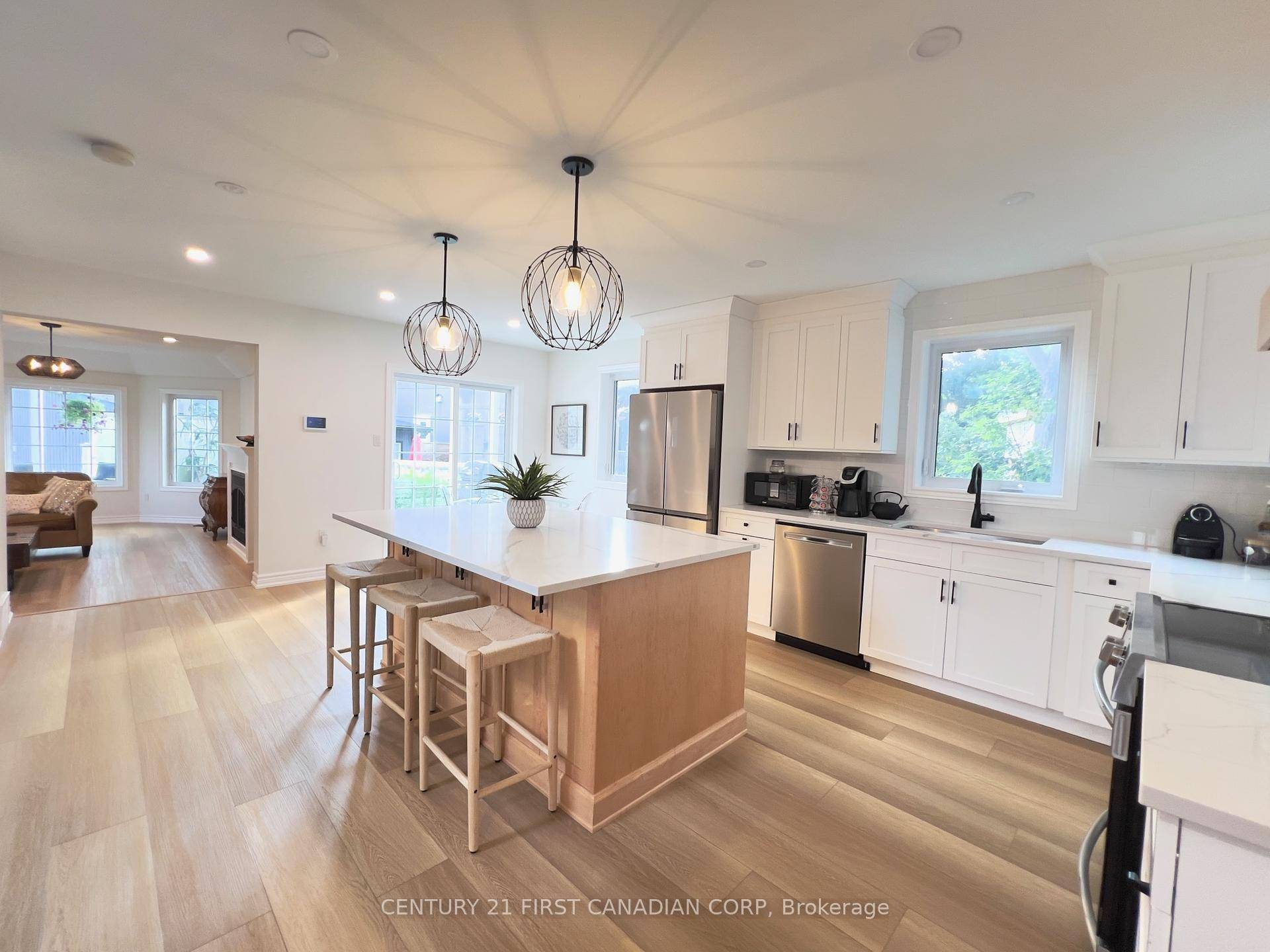 Enjoy breathtaking views from this beautifully designed, extensively updated, 3 bedroom, 4 bath home, just steps from the lake.