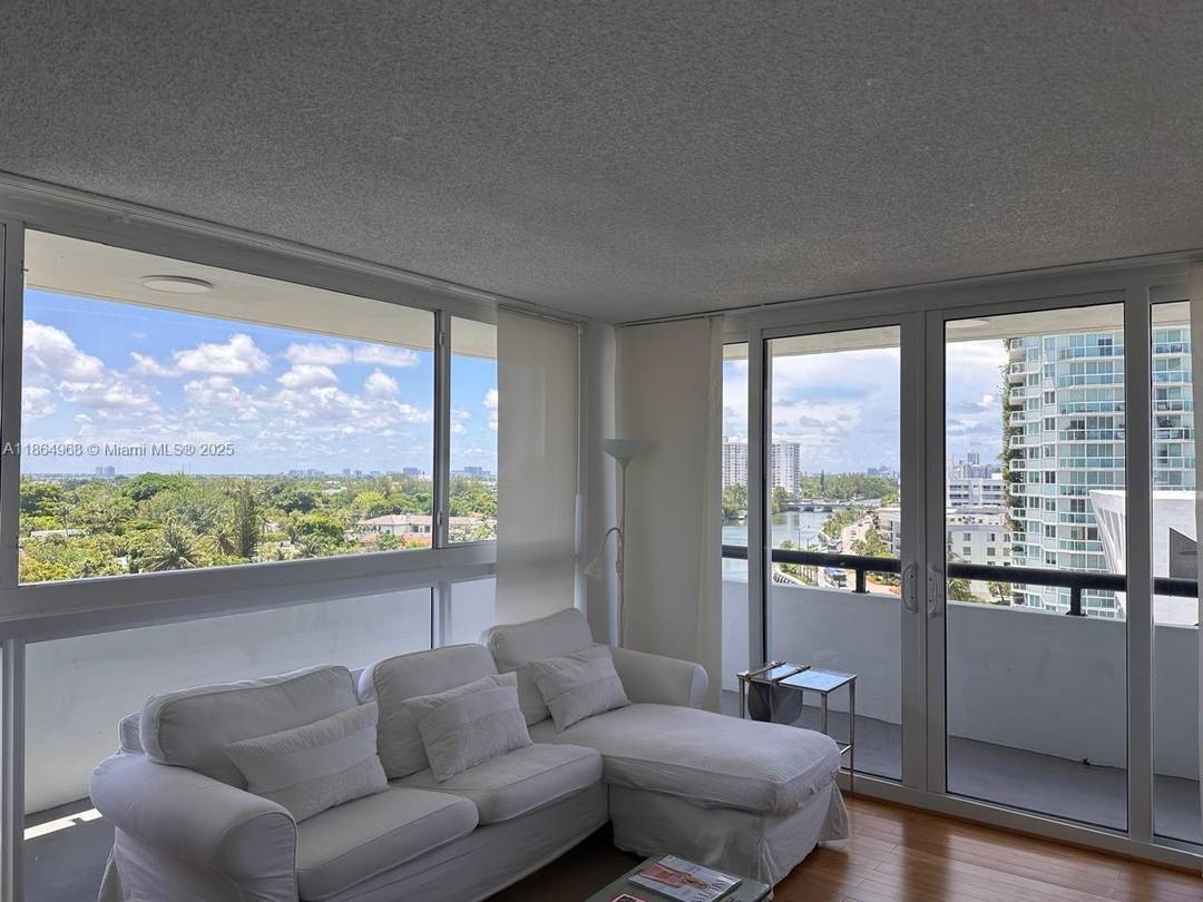 Beautiful, fully furnished 2Bed 2Bath corner unit in Mid Beach with breathtaking canal, city, and ocean views from a large wraparound balcony.