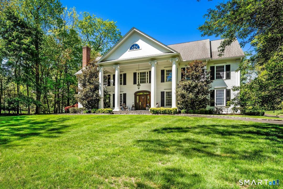 Exquisitely renovated center hall colonial set on two perfectly manicured acres at end of quiet, private cul de sac, offering exceptional space timeless appeal for both everyday living entertaining.