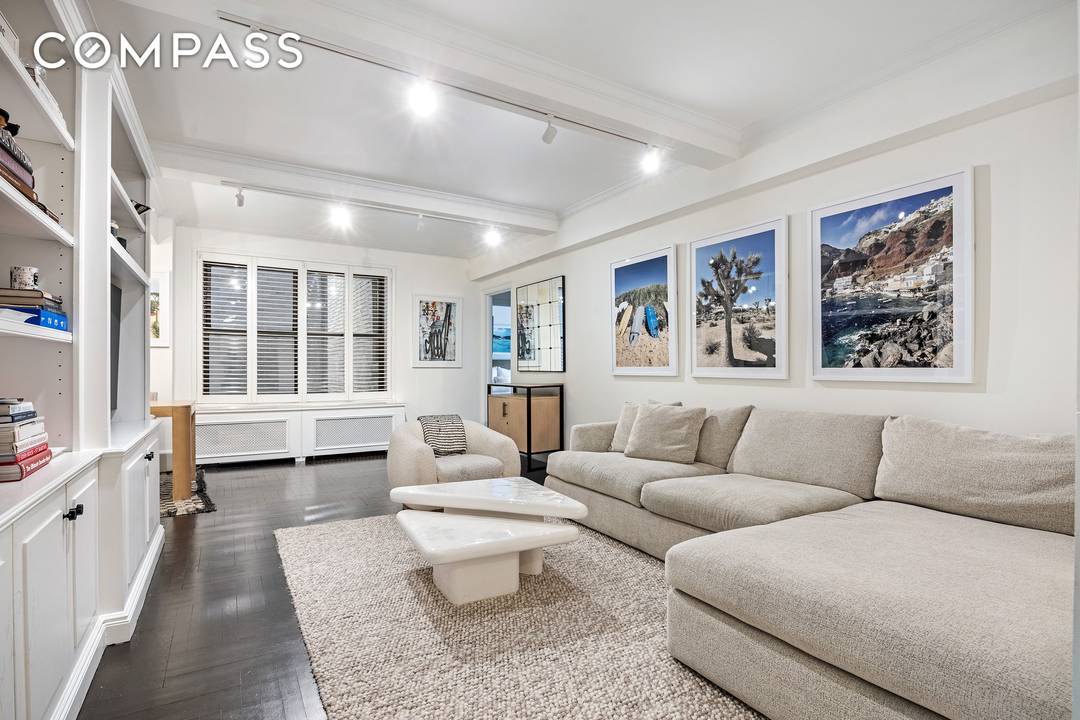 Move right into this warm and inviting, renovated corner two bedroom, two bath prewar residence that perfectly balances classic elegance with everyday comfort.