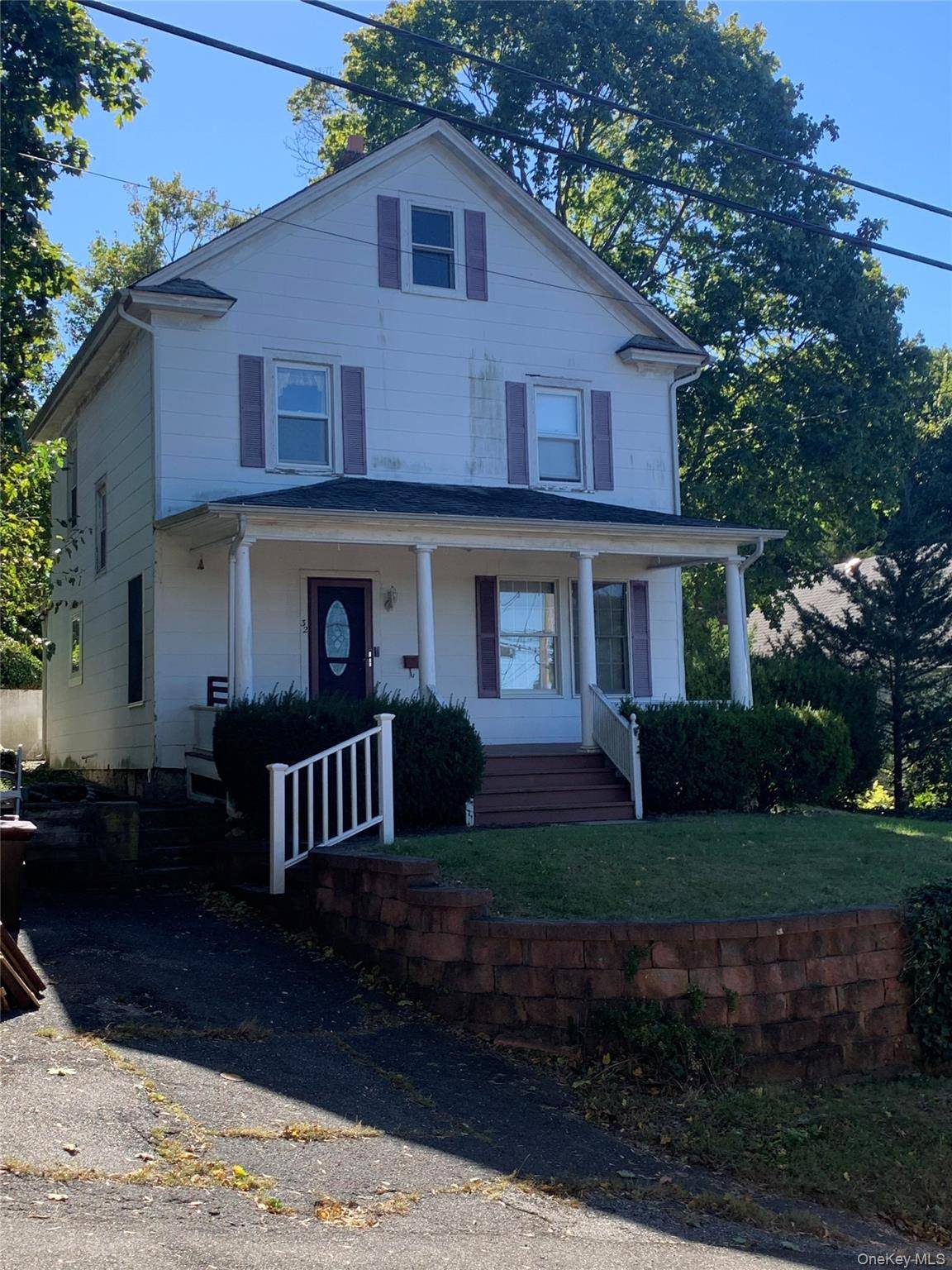 Perched on a hillside, overlooking Northport village, 32 Vail Street is a fixer upper house that wants to be a home again.