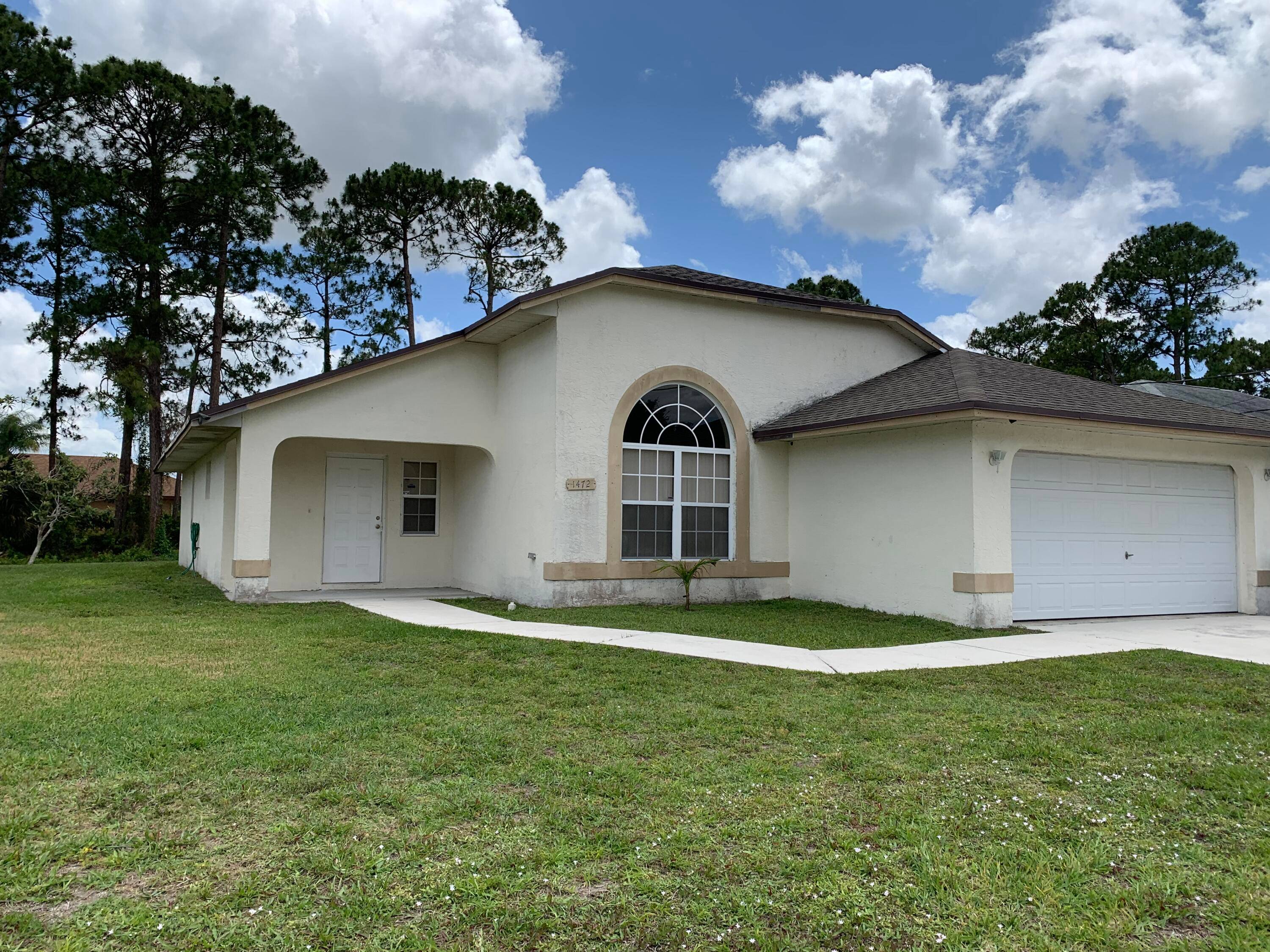 3 2 2 CBS home with den office, or possible 4th bedroom.
