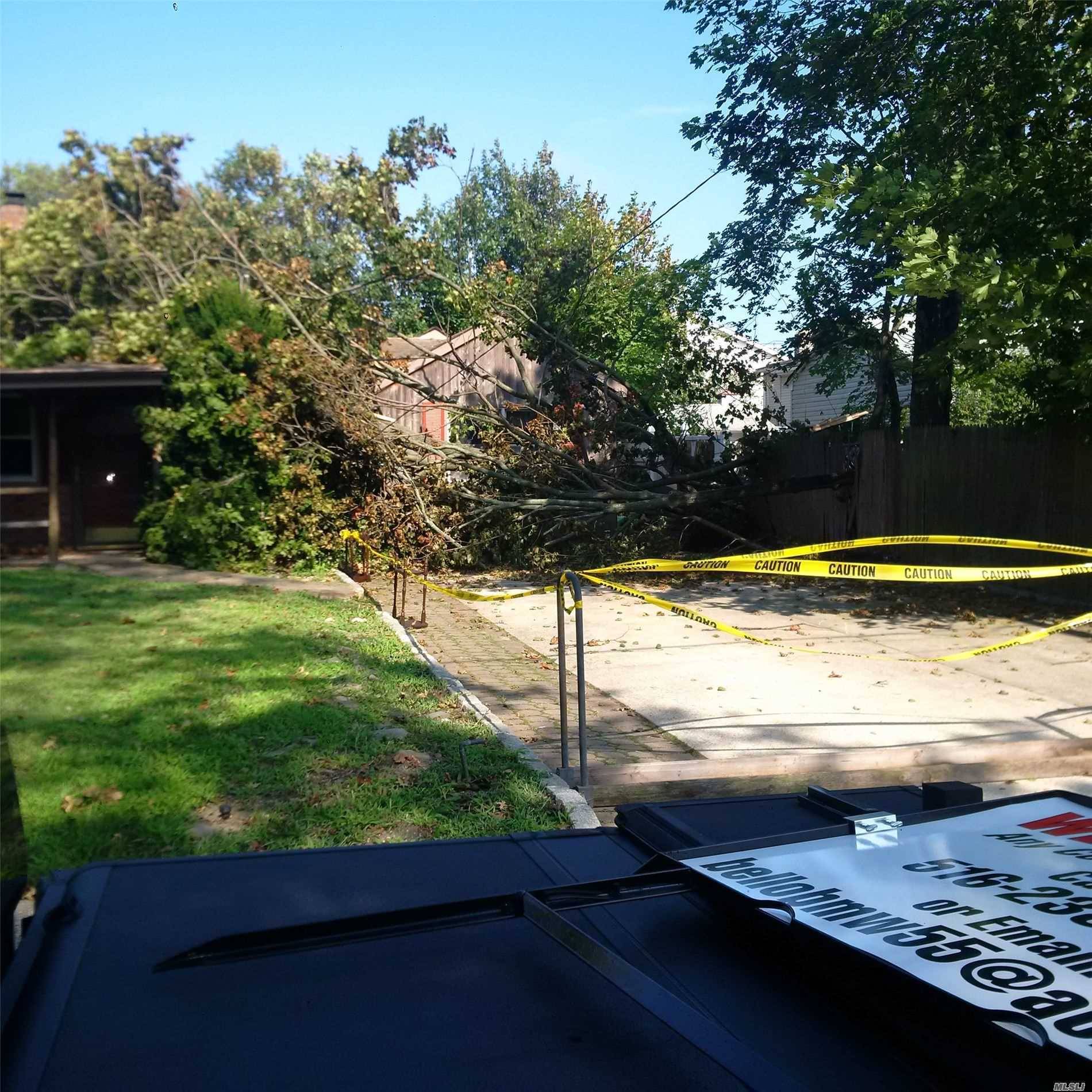 50x100 building lot with spacious 1, 600 square foot ranch that needs some repair.
