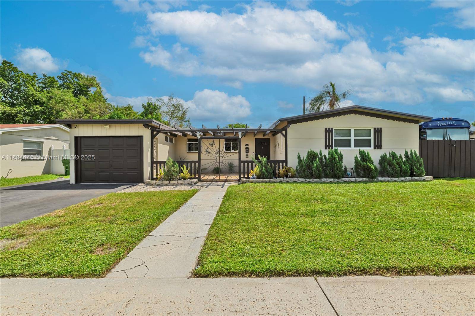 Step into this charming one story ranch style home with welcoming foyer featuring a private pool, 1 car garage, and two functional storage sheds.