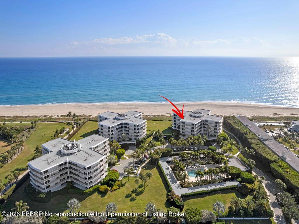 Impeccably renovated 3BR 3BA corner residence offers coastal living with sweeping ocean, Intracoastal, and pool views from a spacious wraparound terrace.