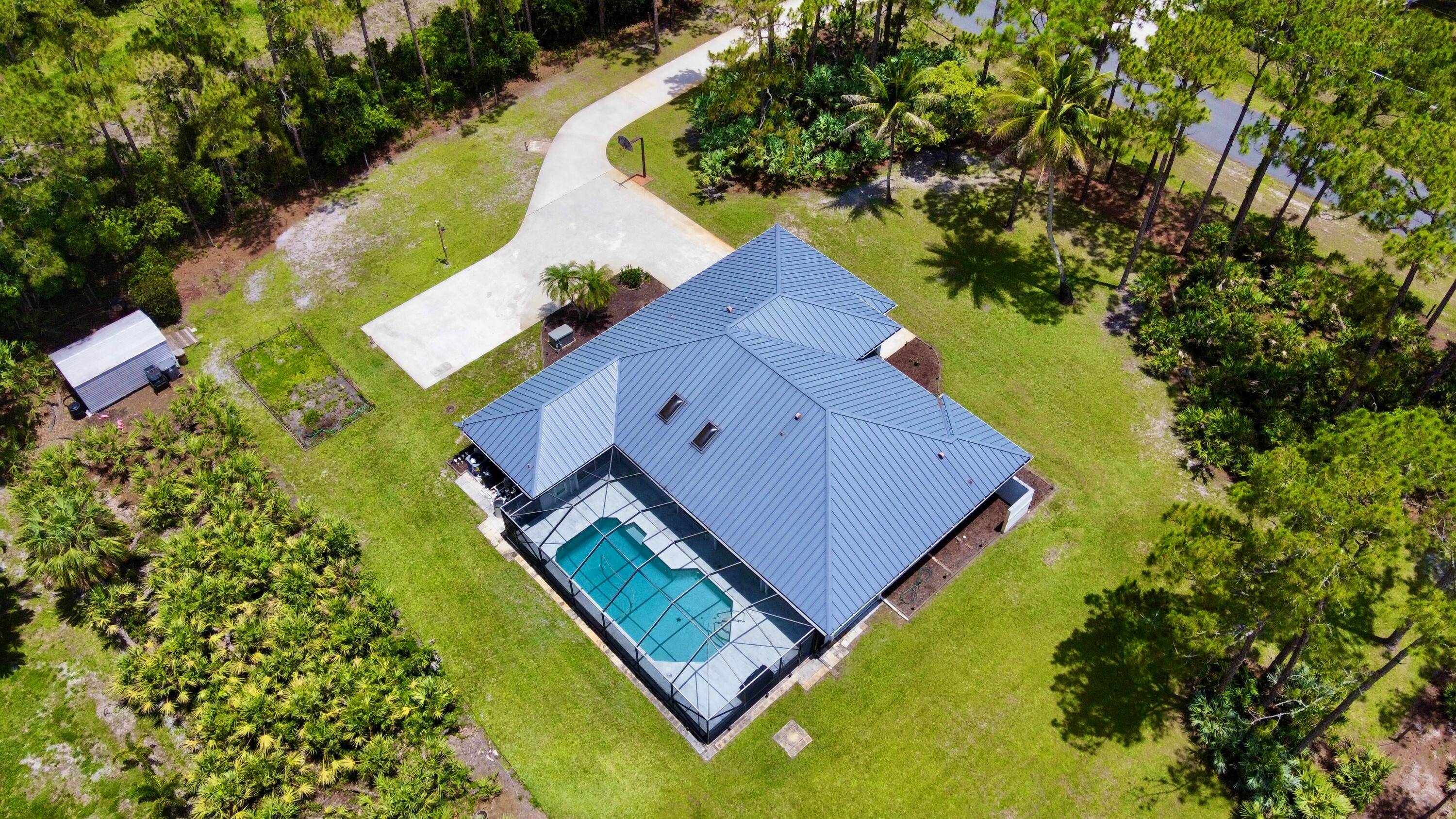 Impeccably maintained CBS 4 Bedroom 3 Bathroom 2 Car Garage POOL home on a PAVED road with Whole House Generator !