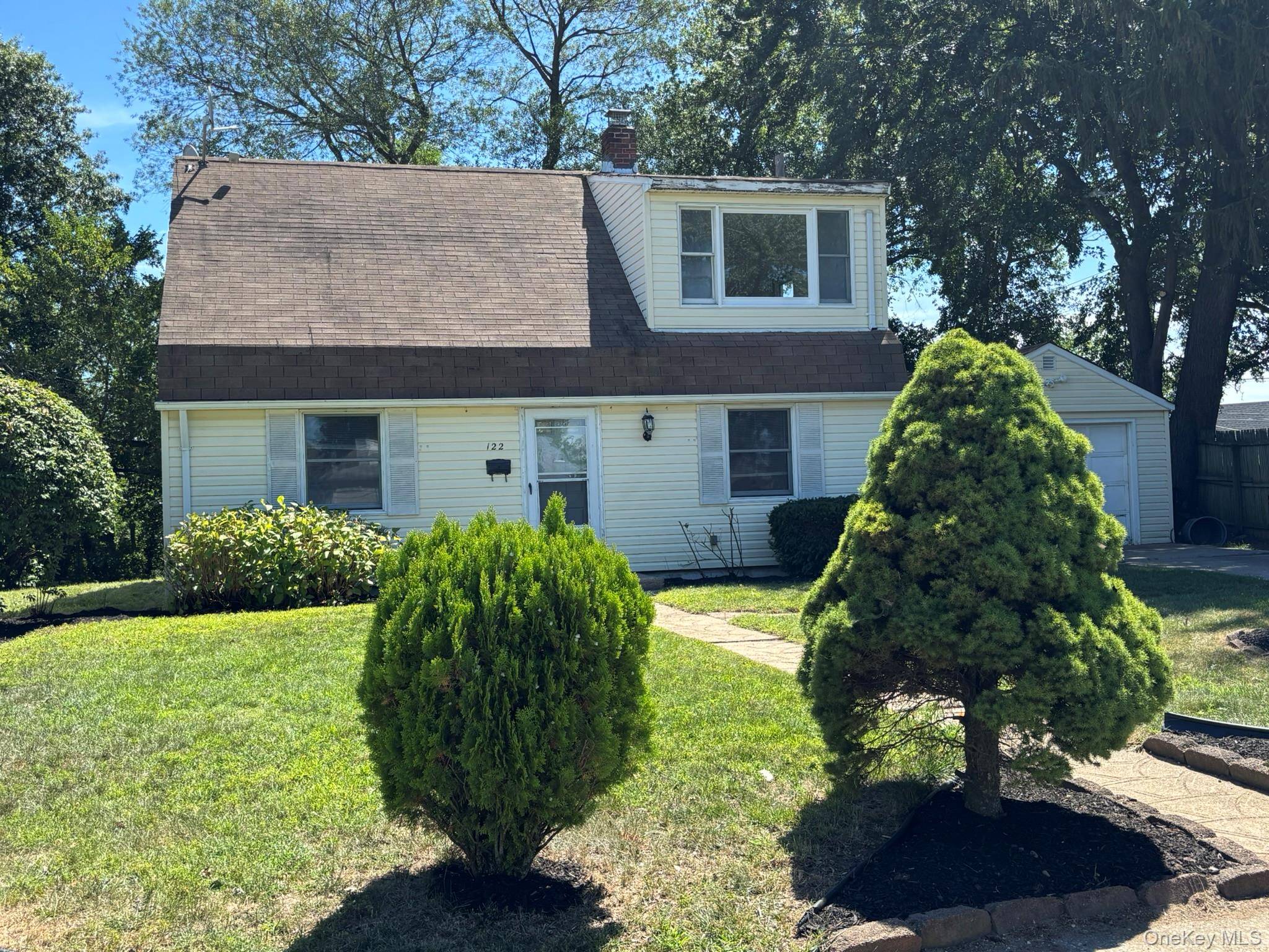 lovely 4 bedroom cape, partial front dormer, needs updating, oversized detached garage, big backyard sliding doors out to yard could be den or 4th bedroom excellent location