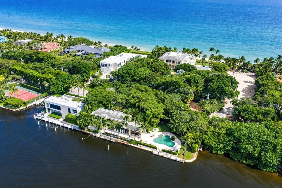 This gated estate is perfectly positioned on over two acres of prized Ocean to Intracoastal property along prestigious Hillsboro Mile.