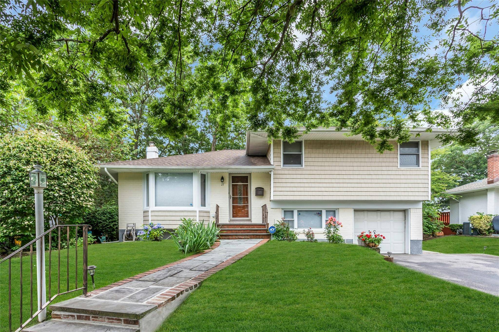 Welcome to this beautifully updated split level home, located in the highly sought after East Birchwood neighborhood within the top rated Jericho School District.