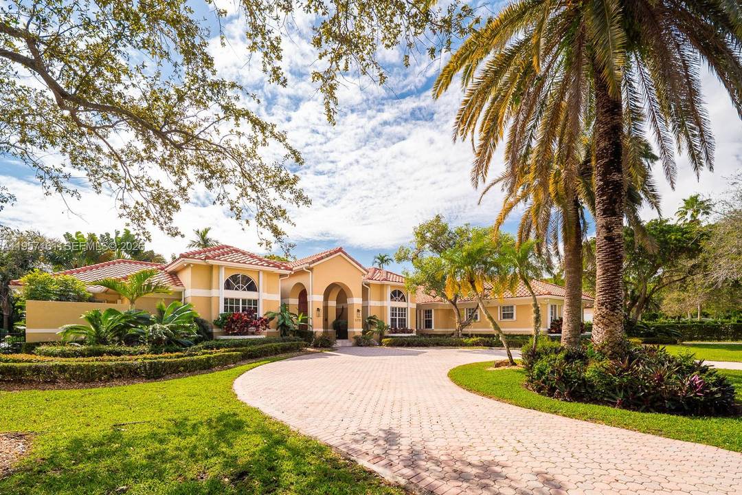 Step into timeless elegance in this Tuscan inspired estate, perfectly set on a lush 31, 888 SF lot with a heated saline swimming pool designed for year round enjoyment.