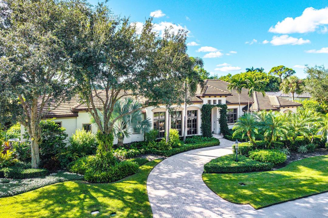 Experience Ultra Luxury in This Sprawling Single Story Estate at Prestigious Old Marsh Golf Club.