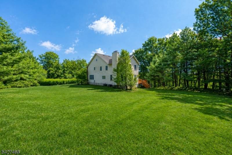 Welcome to a stately, classic Colonial set on a private, park like setting near Union Hill Farms.
