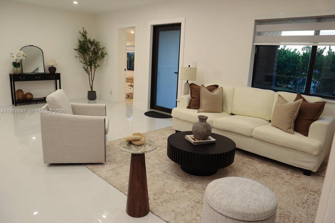 Spacious corner lot residence offering 4 bedrooms, 4 full bathrooms plus a half bath, including multiple ensuite bedrooms and a dedicated office space.