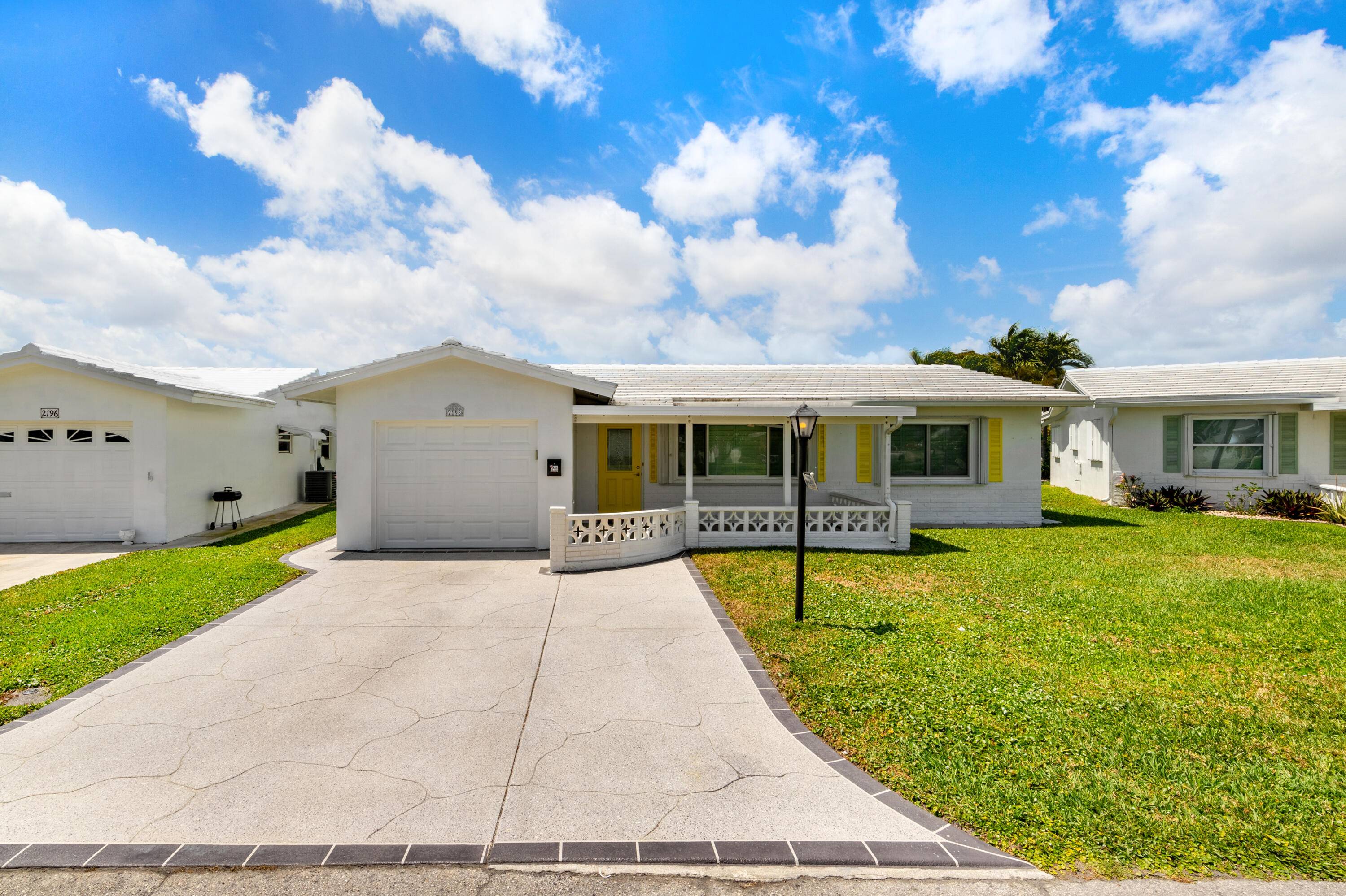 Nestled within 55 Palm Beach Leisureville, this expanded Edgewood model offers updated bathrooms and kitchen with granite counters and custom cabinets.