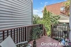 Home for the Holidays ! Move into this oversized 4 bedroom with Balcony in Prime Middle Village Location.