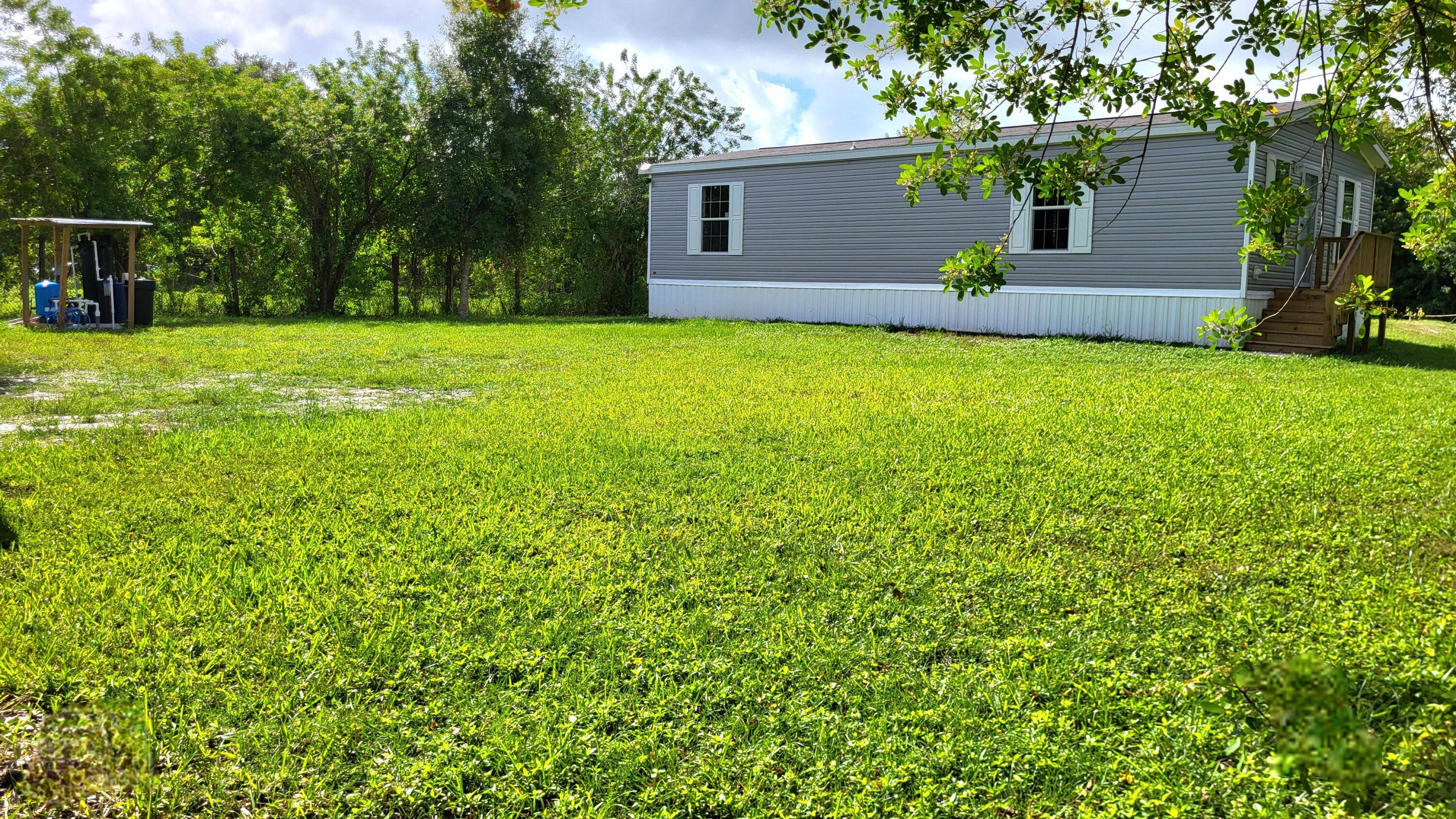 Take in the distant sounds of a rooster as you wake in your brand new home on nearly a 1 2 acre.