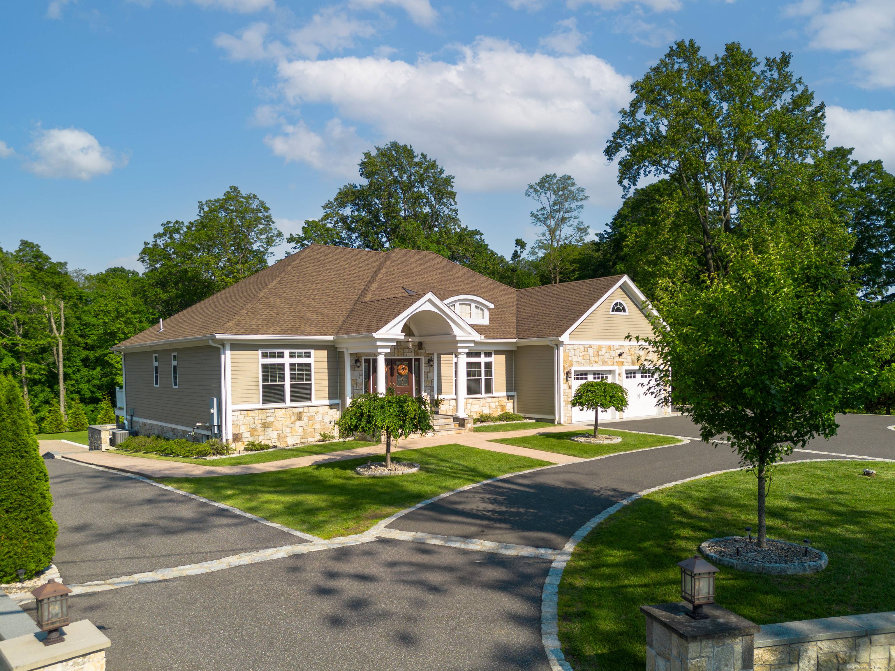 Live the luxury you deserve in this majestic double level Ranch embraced by circular drive and estate stone walls on 2.
