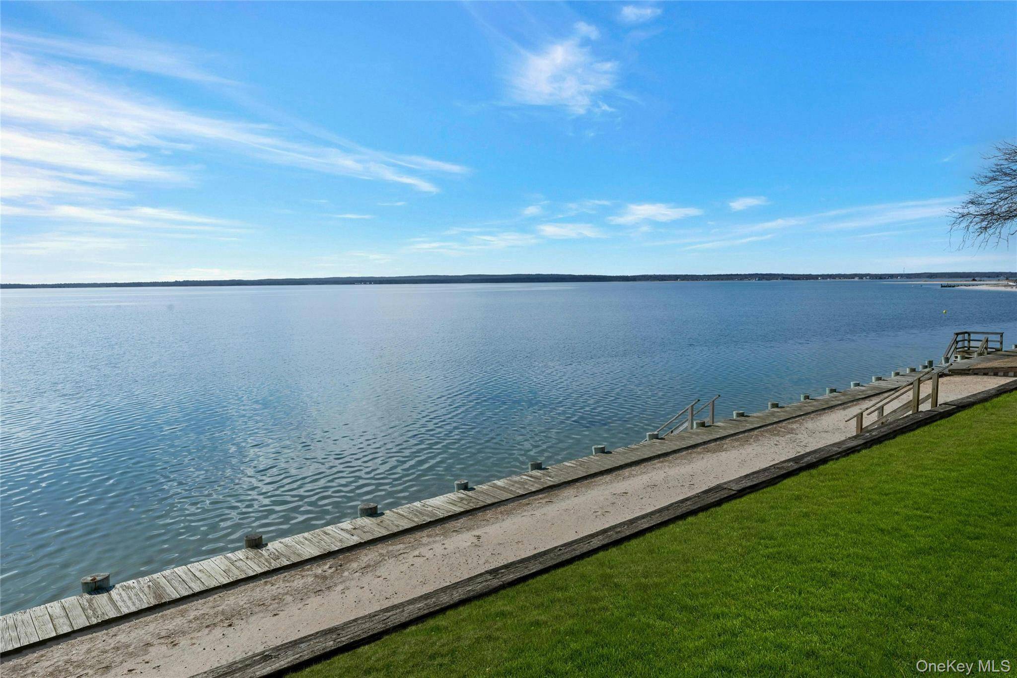 NORTH FORK DIRECT BAY FRONT GEM ON QUIET STREET WITH HIGH ELEVATION AND 115' FRONTAGE Introducing a captivating waterfront property on the Peconic Bay in Jamesport boasting a large lot ...
