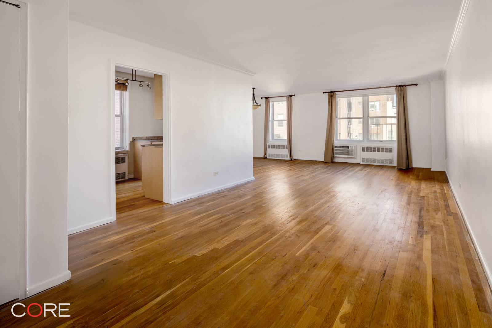 Approximately 935 square feet, this sunny, corner one bedroom with a dining alcove has the potential to be convertible to two bedrooms.