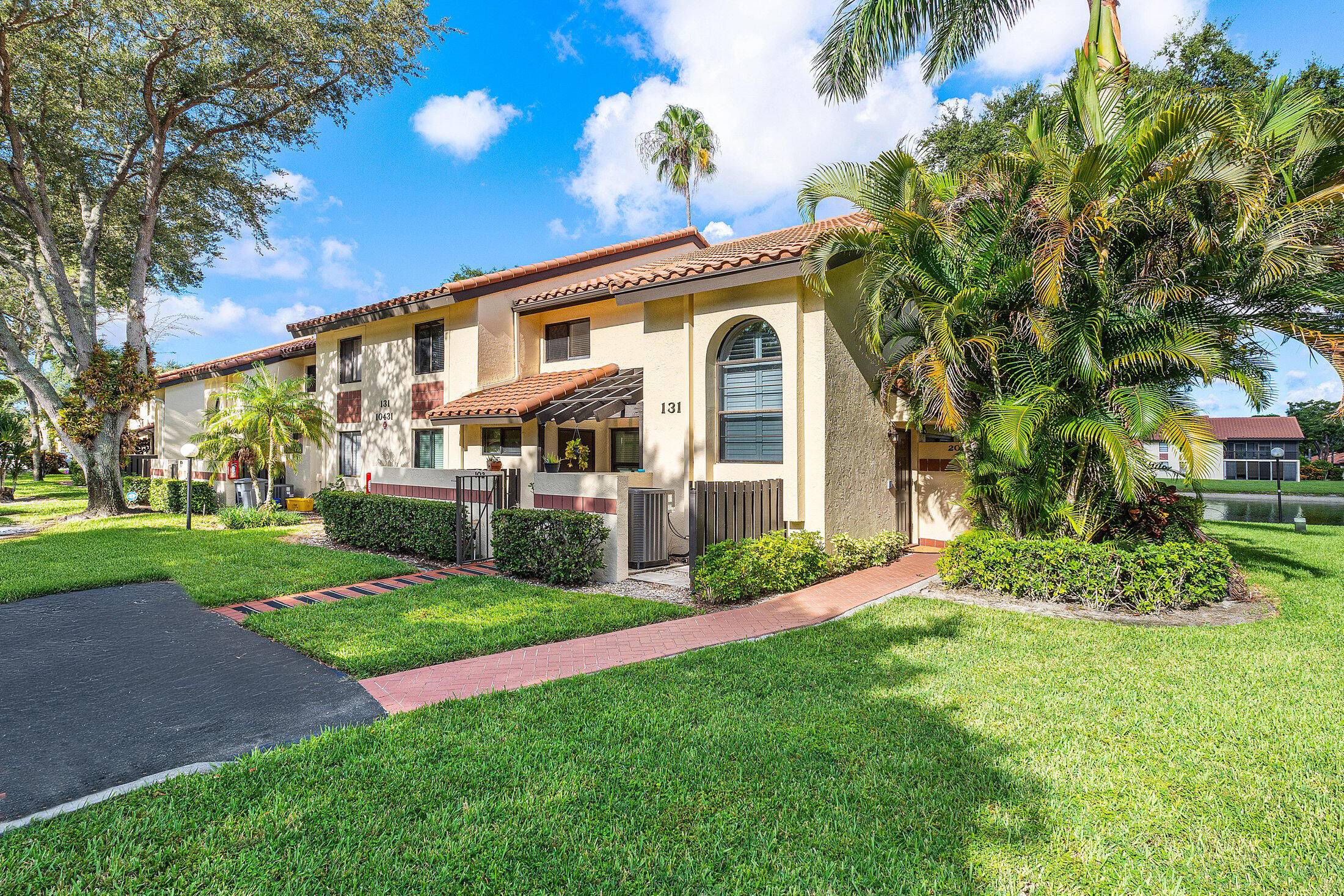 Unique opportunity to own a REMODELED, 3 2 CORNER UNIT in desirable 55 Palm Chase Lakes.