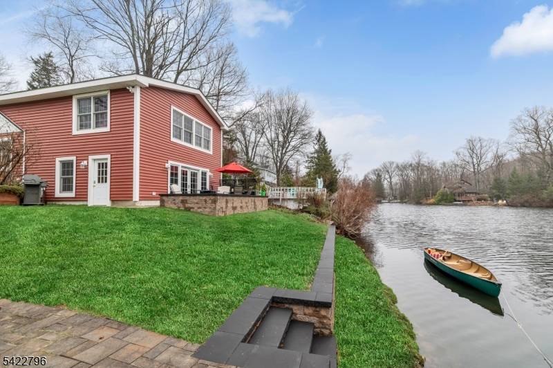 Welcome to this charming lakefront 2BR, 2BA home on Upper Mt.