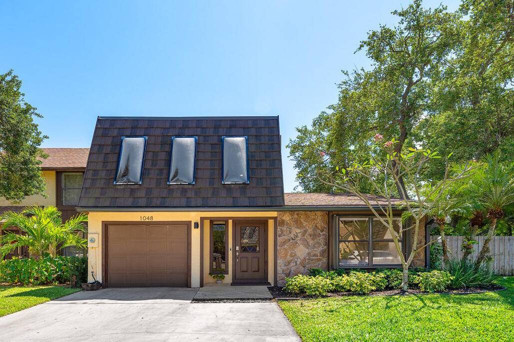 Welcome to this beautifully updated waterfront townhome, nestled in the desirable community of Town Oaks.