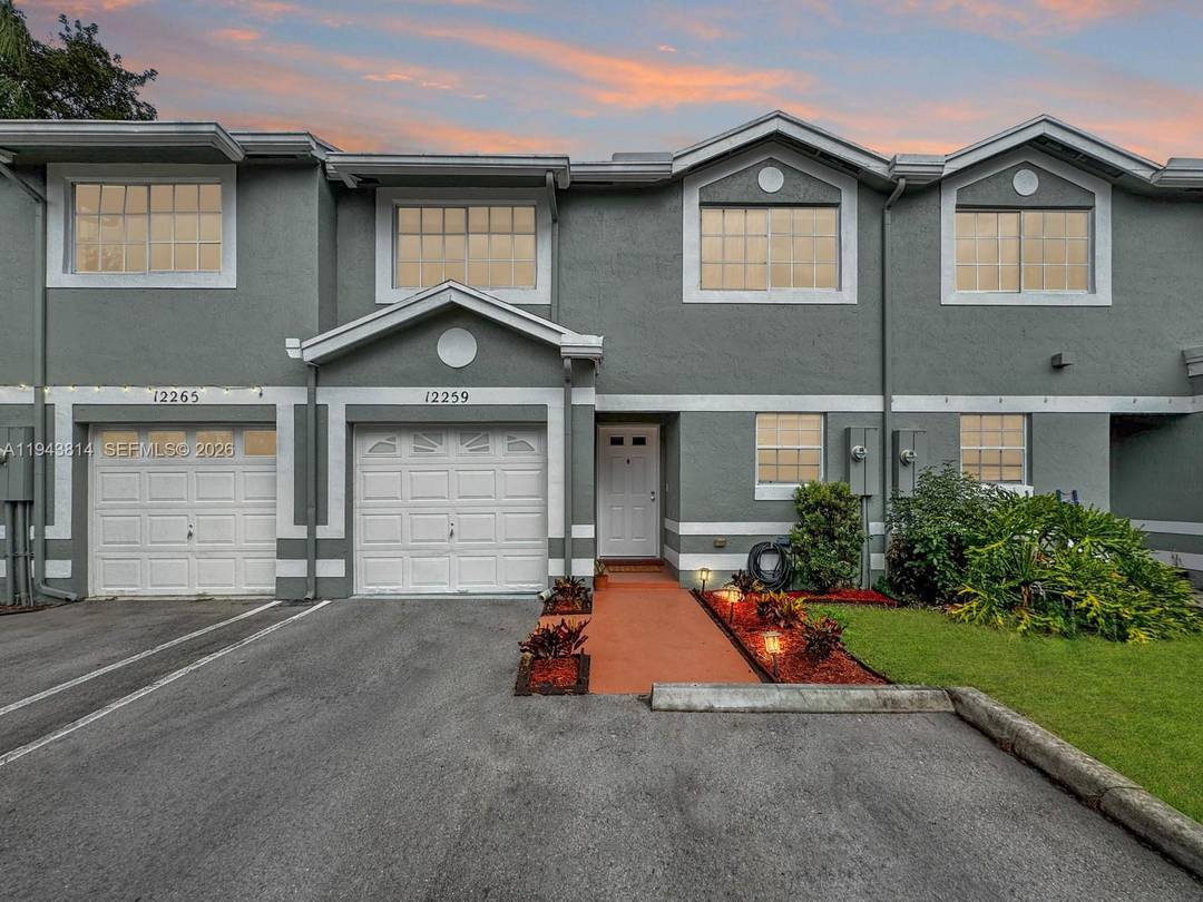 This light and bright townhouse is located in the Flamingo Gardens community of Cooper City.