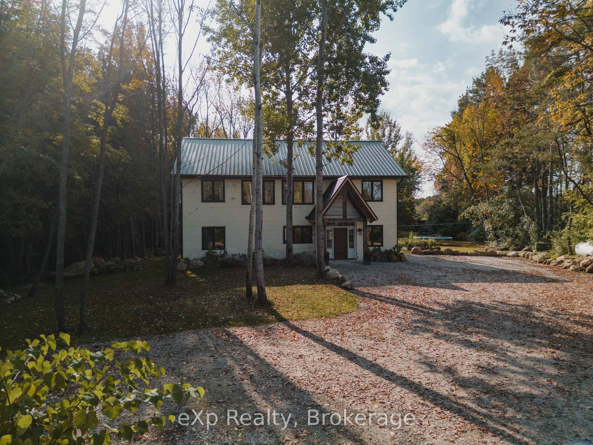 Located just outside the sought after town of Meaford, this custom built modern home sits on 29 acres 20 of which are thriving apple orchards.