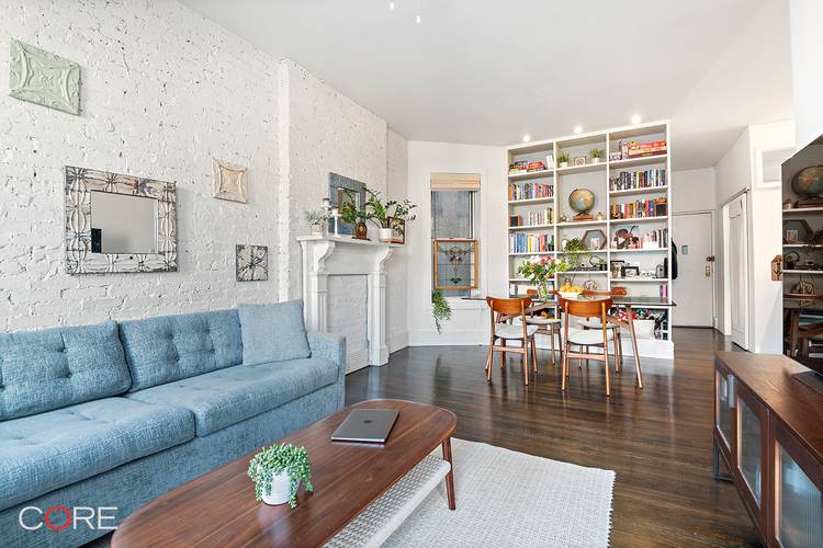 This bright and airy home features nine windows in total, a spacious living and dining area ideal for entertaining, gorgeous hardwood floors, and a beautifully renovated, custom designed kitchen.