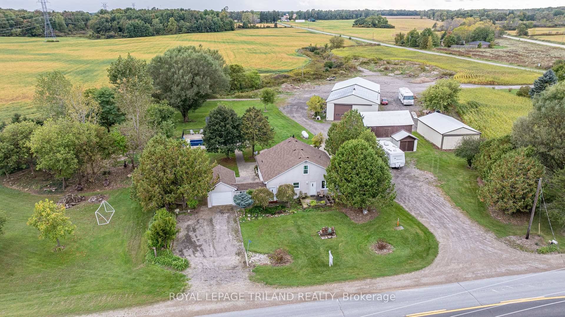 Welcome to 12249 Mill Rd, Southwold Featuring a Massive 40x80 Heated Shop with Three Large bay doors !