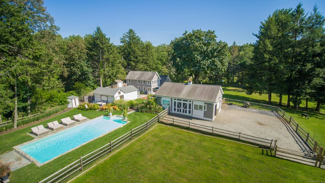 Embrace the tranquility of this exceptional equestrian estate, nestled on 4.
