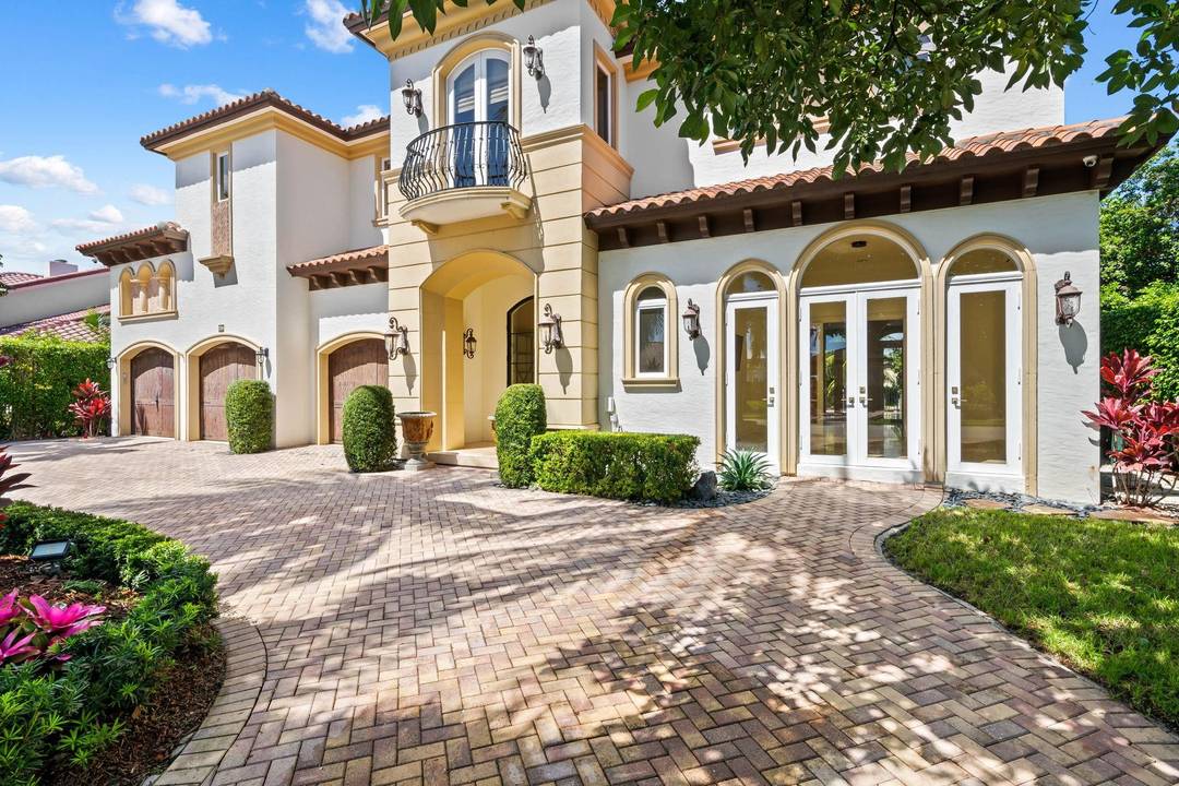 Experience timeless elegance in this Mediterranean inspired estate, ideally situated on Tropic Isle's prestigious deepwater canal.