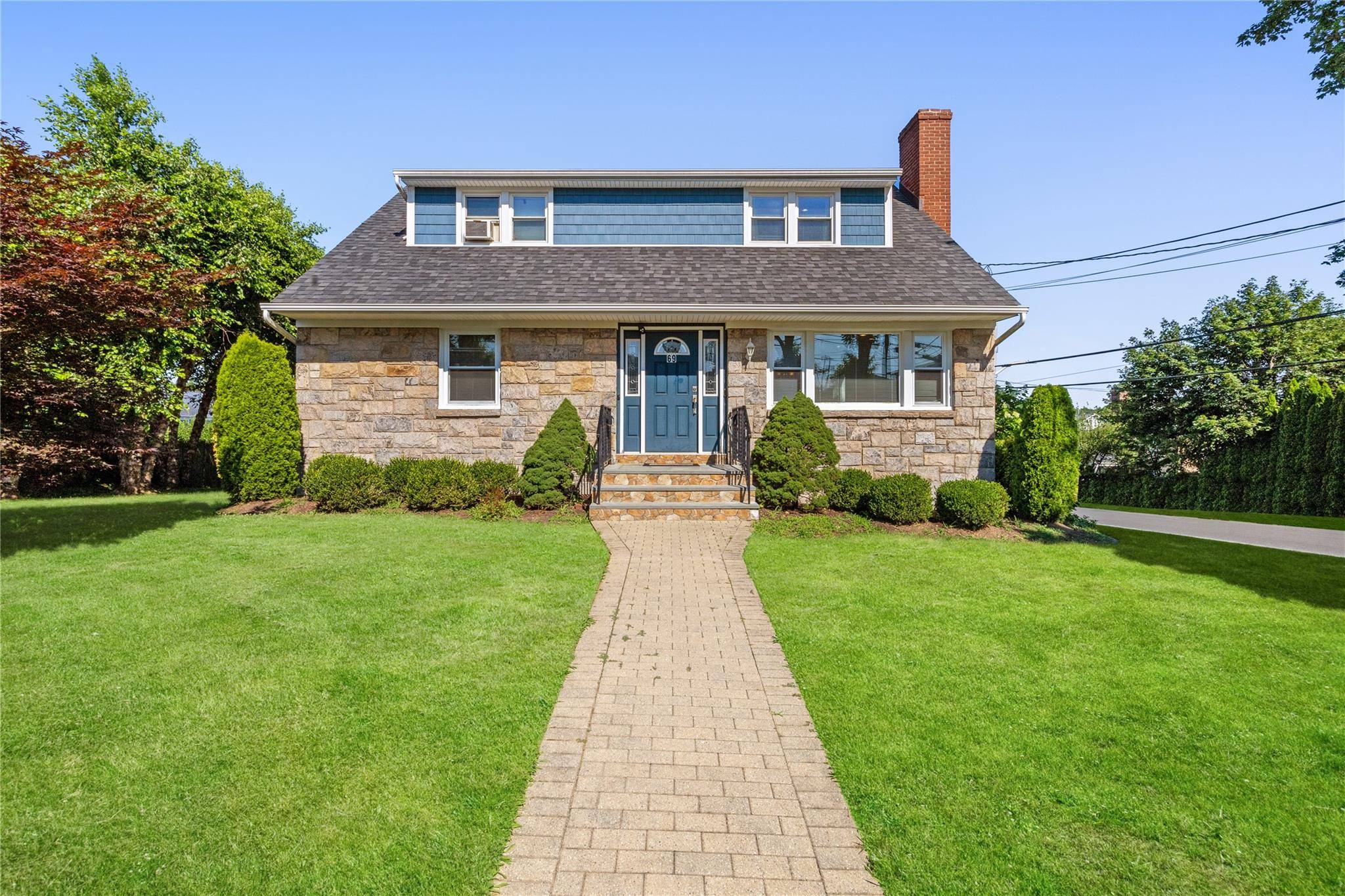Nestled on a level, oversized corner lot, this beautifully updated 2 family home offers exceptional value and versatility in the heart of West Harrison.