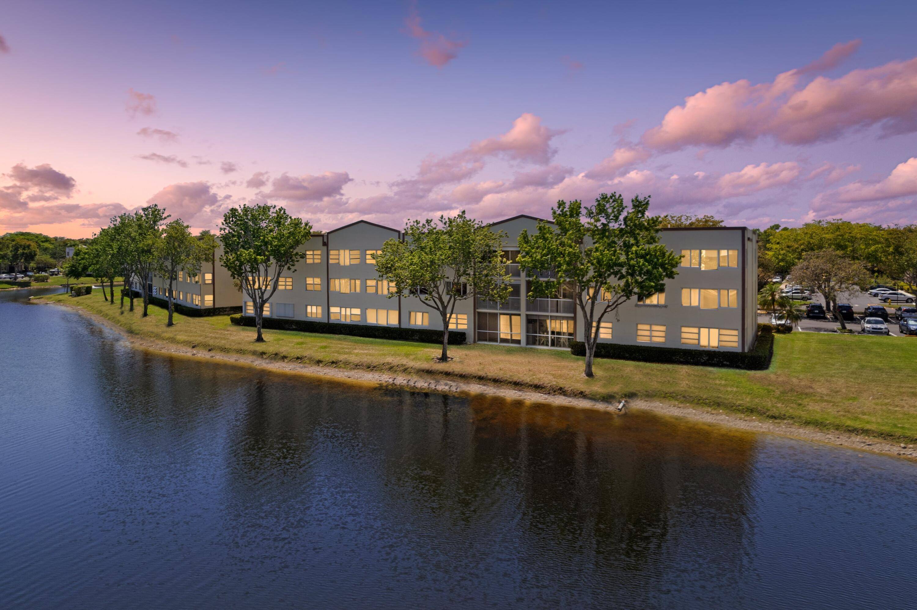 GORGEOUS WATERFRONT CONDO STUNNING LAKE VIEWS PRESTIGIOUS 55 COMMUNITY OF KINGS POINT Bright Open Floor Plan LED Custom Lighting Eat In Kitchen with Breakfast Nook White Wood Cabinets Pantry Primary ...