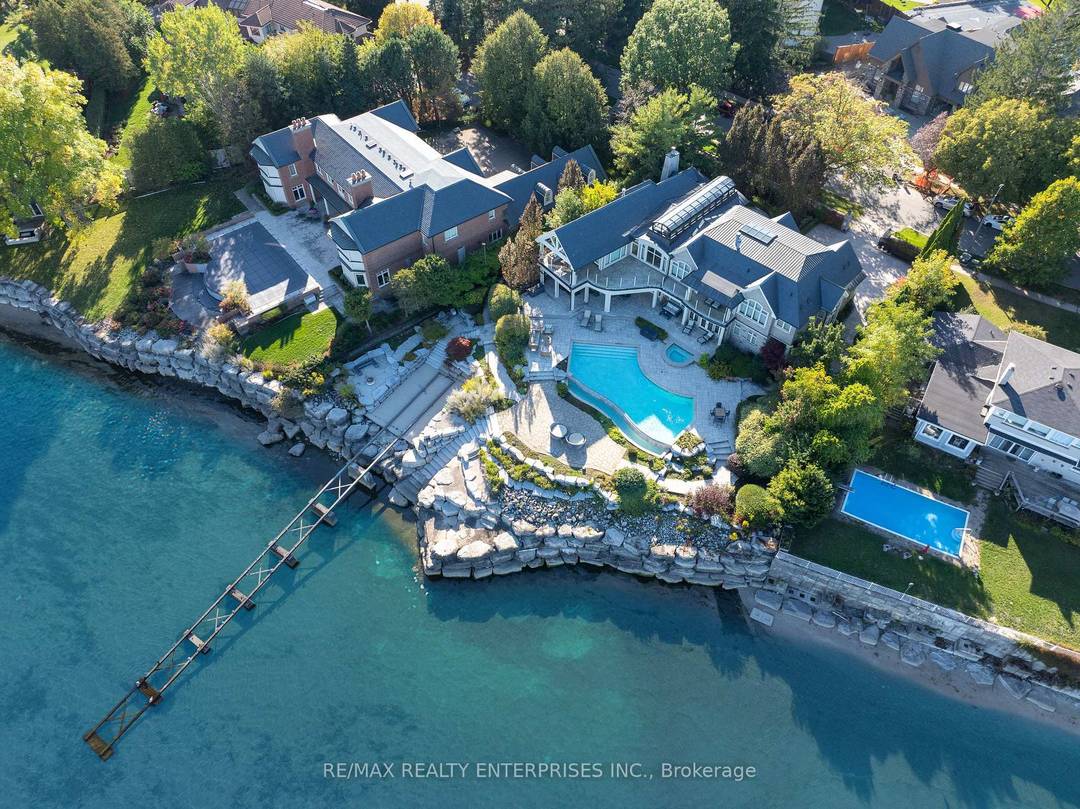 An Extraordinary Expression Of Waterfront Luxury, This Riparian Right Lake Ontario Estate Is A Rare Architectural Masterpiece Nestled Within The Prestigious Enclave Of Rattray Park Estates.