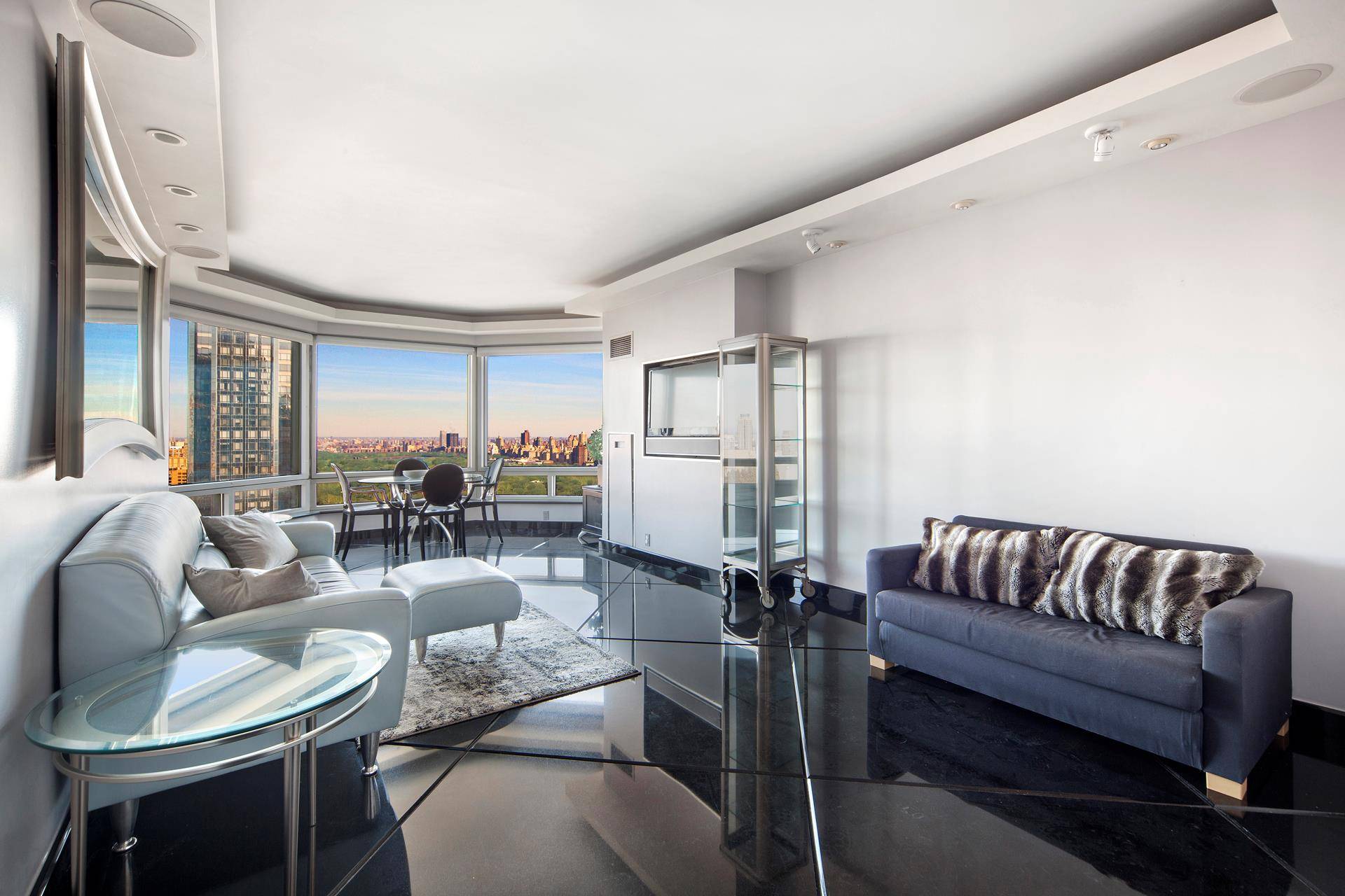 Located high above Columbus Circle, enjoy priceless, unobstructed views of Central Park and the Manhattan skyline from floor to ceiling Bay Windows, this high floor one bedroom, one bathroom condominium ...