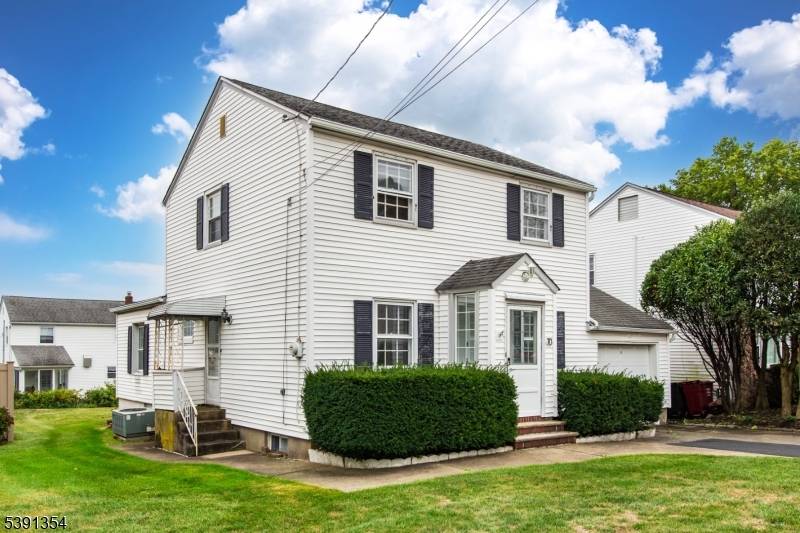 Fall in love with this charming two three bedroom Colonial, located on one of Nutley's most desirable streets.