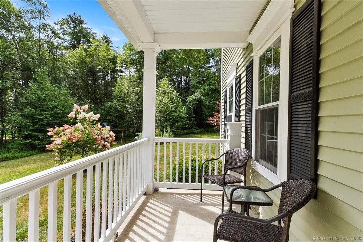 Feel worlds away while being less than 2 miles to town amenities in this like new retreat nestled on an expansive 11.