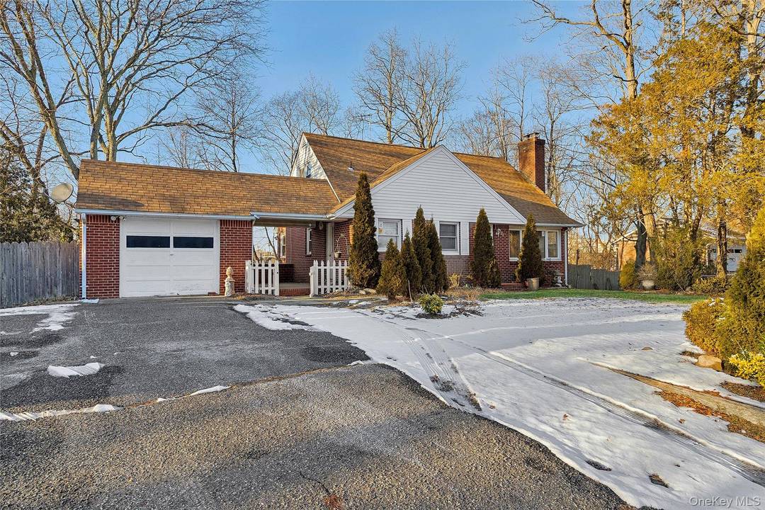 Welcome to this Expanded Cape in the heart of Lake Grove Village.