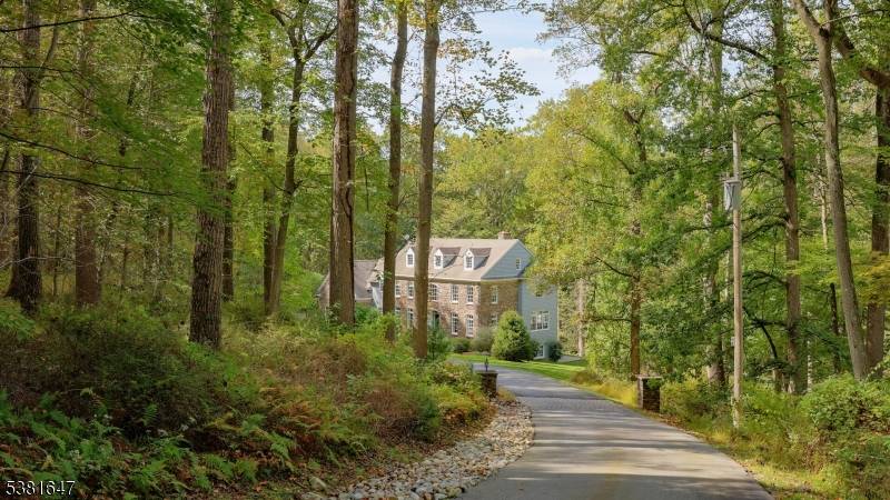 For those seeking privacy and seclusion this property is set down a long private road in the heart of sought after Bernardsville Mountain.